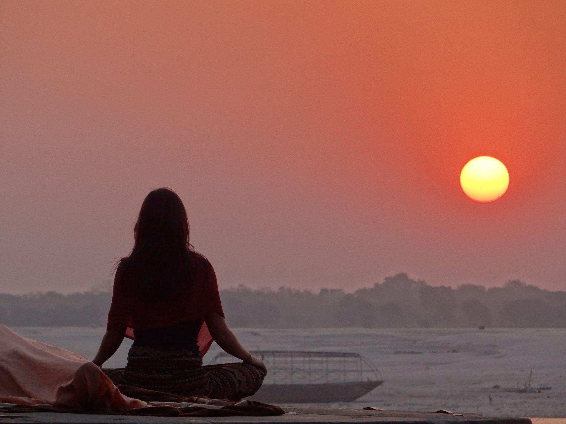 Meditation by the water at a spiritual retreat